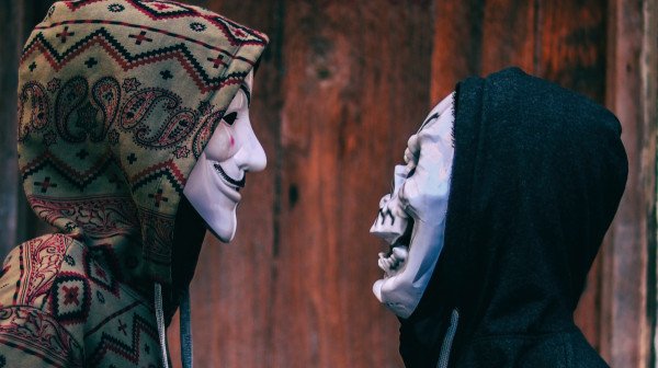 Two hackers with guy hawkes mask / design ethics